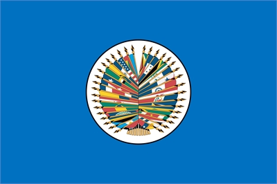 [ai] The flag of the Organization of American States (OAS) featuring a central emblem of eighteen colored flags arranged in a circular pattern, surrounded by blue background.
